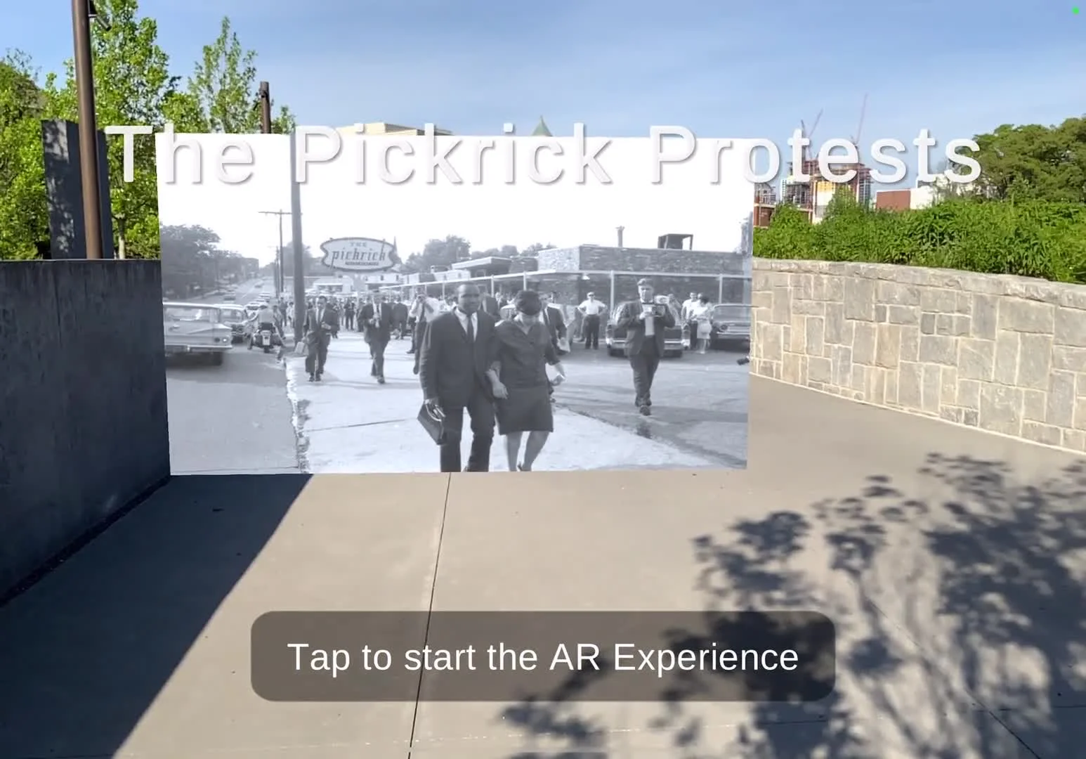 AR experience launch screen overlaying an archival photo